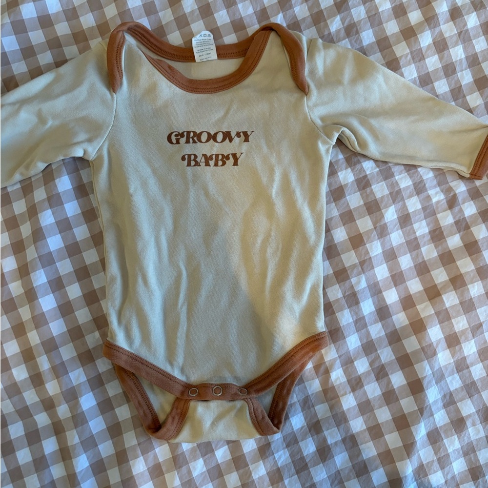 Kate Quinn Cream and Brown Baby Onesie